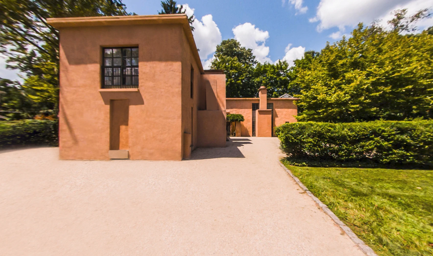 Exterior view of the Michael Graves residence showing its terracotta stucco facade